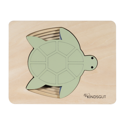 Kindsgut – Holzpuzzle mit fünf Schildkrötenformen im Rahmen